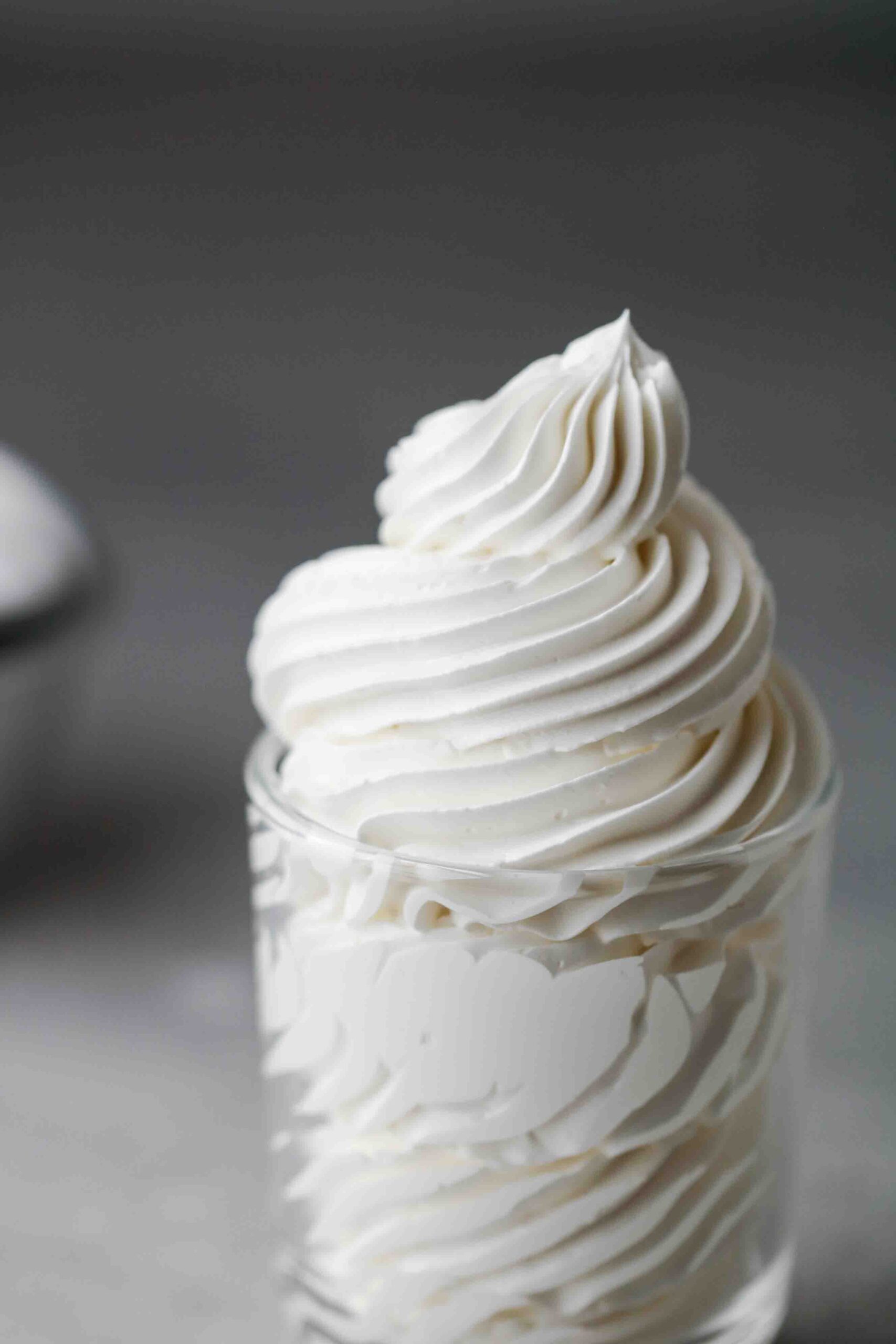 Swiss meringue buttercream piped in a cup