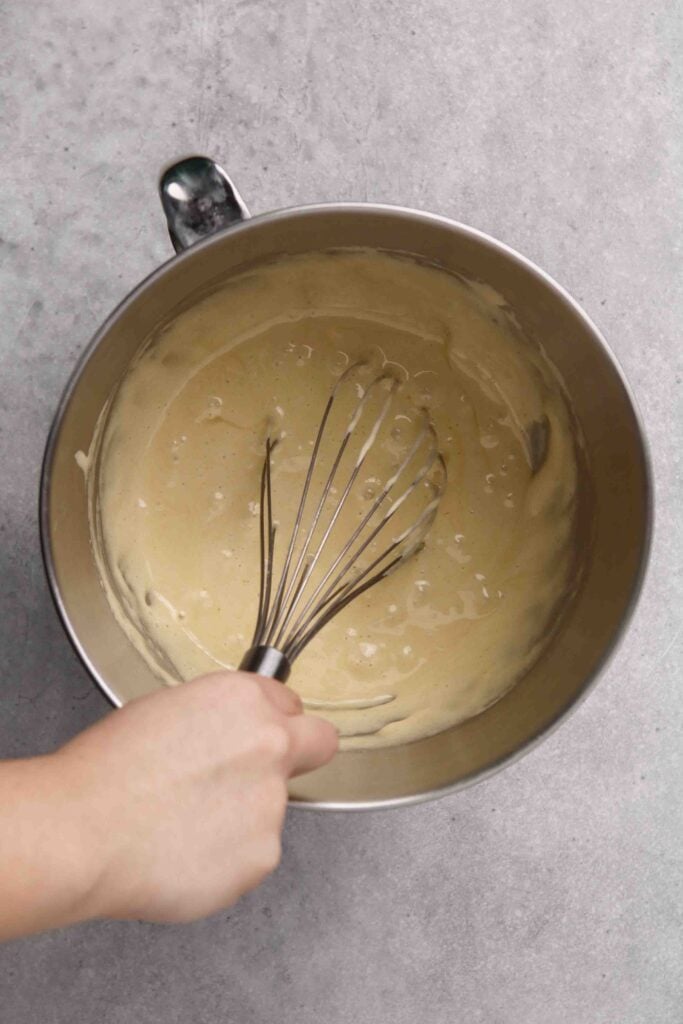 Add in the melted white chocolate mixture to the egg mixture