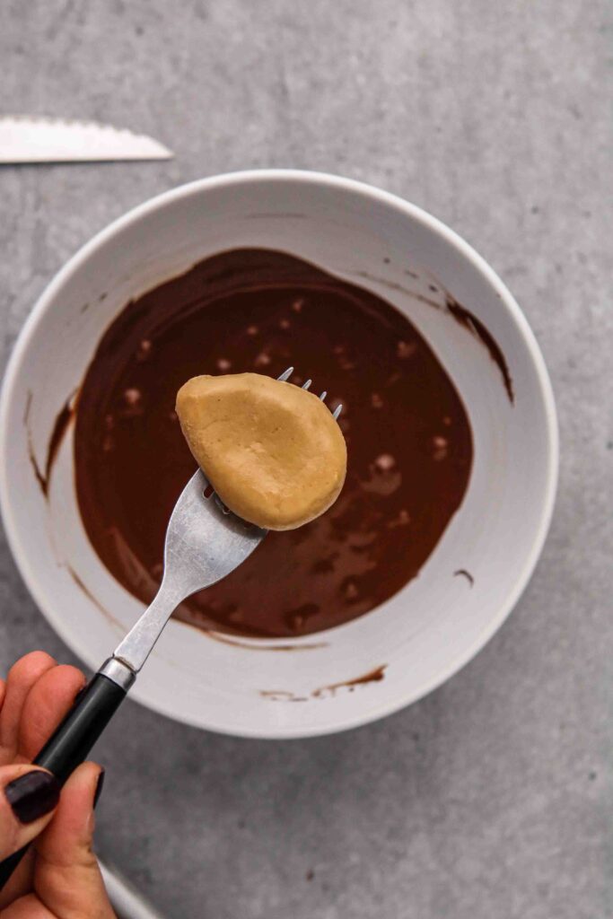 Freeze the peanut butter eggs before dipping in chocolate
