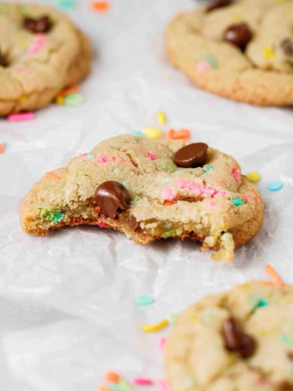 Spring chocolate chip cookie with a bite taken out of it