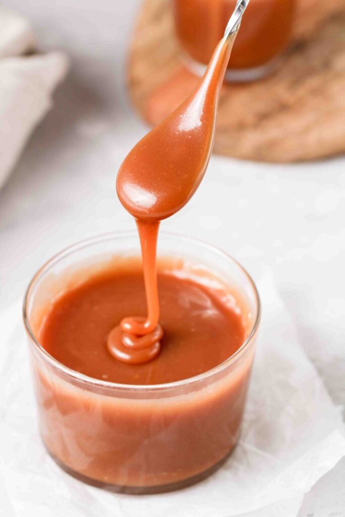 Caramel sauce in a spoon