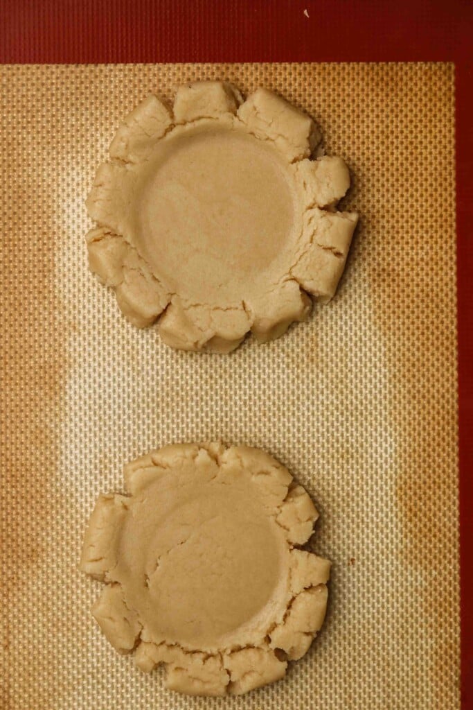 Raw sugar cookies on a baking sheet