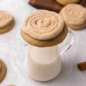 Crumbl churro cookie on a glass of milk