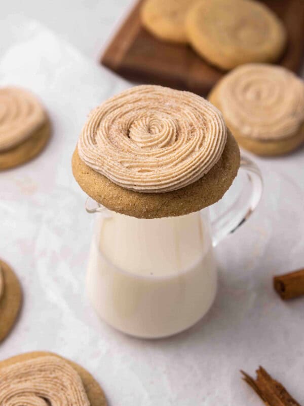 Crumbl churro cookie on a glass of milk