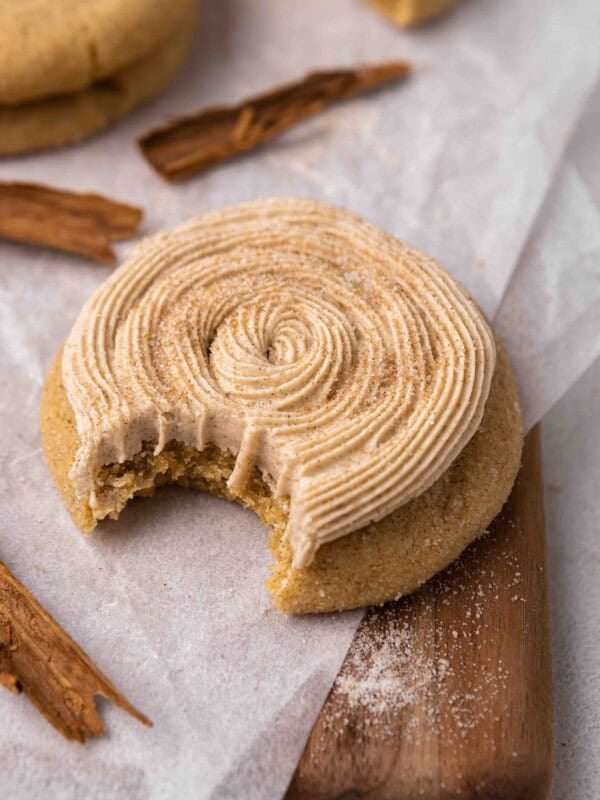 CRUMBL churro sugar cookie with a bite taken out of it