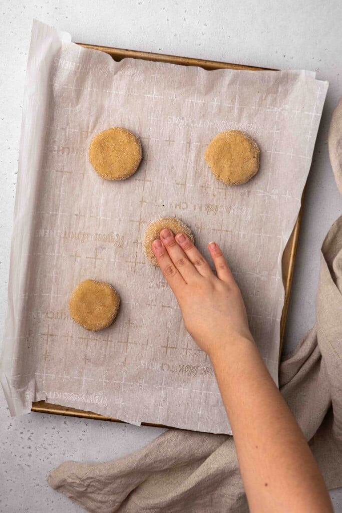 Hand flattening cookie dough