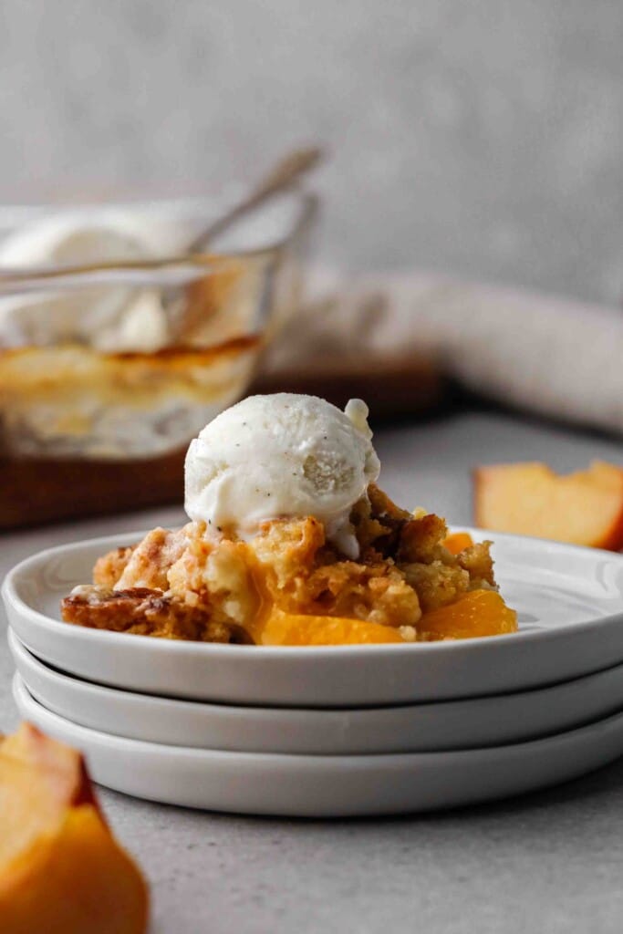 Cake mix cobbler served on a plate with ice cream