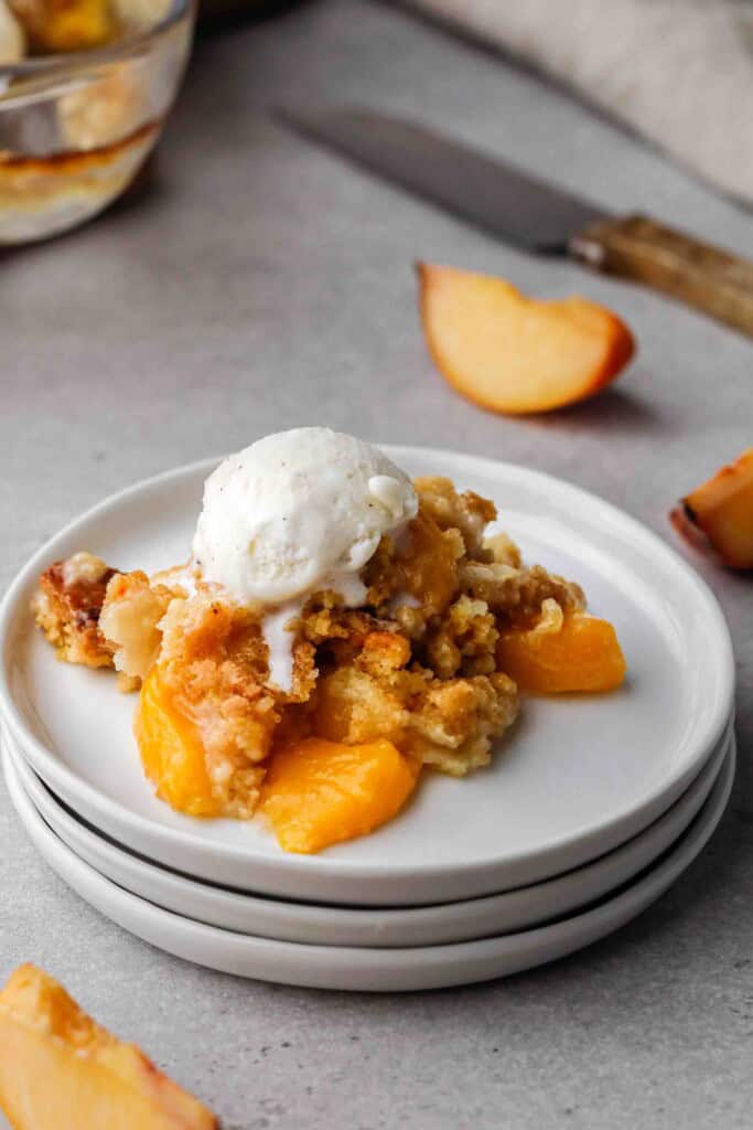 Peach cobbler with ice cream on top