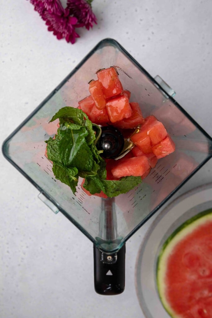 Watermelon, mint, and honey in a blender