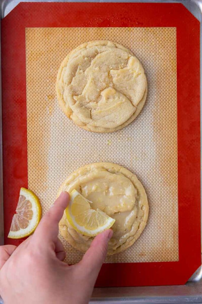 Hand placing lemon on cookie