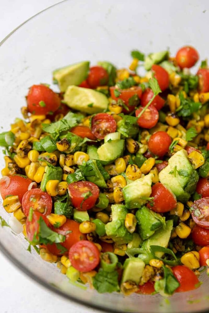 Close up of summer roasted corn salad with avocados