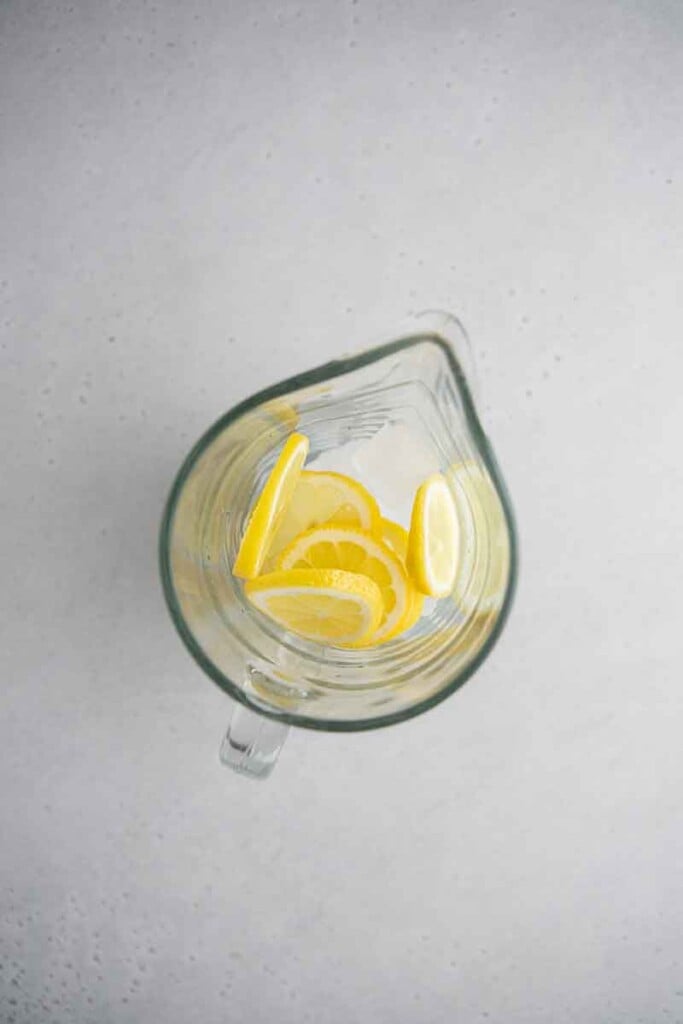 Lemon sliced and ice in pitcher