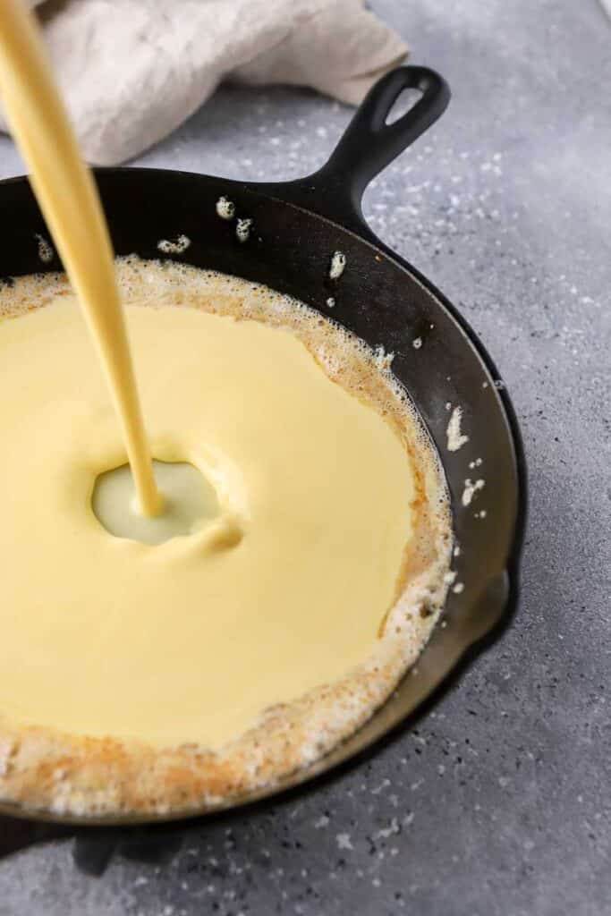 pancake batter poured in a skillet
