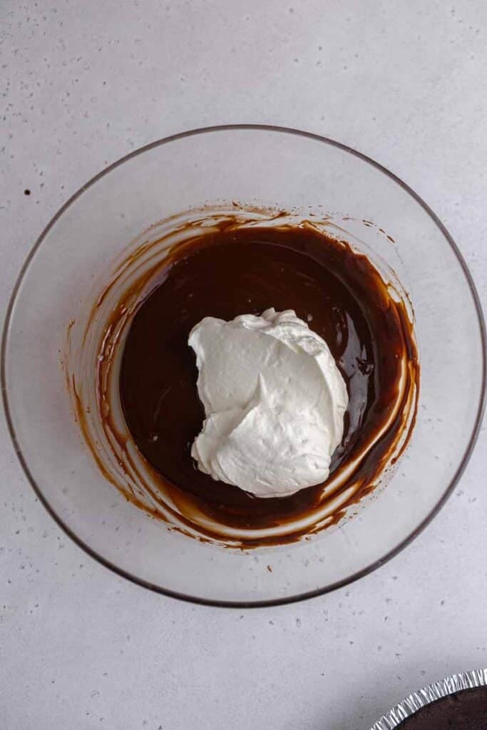 whipped cream on chocolate ganache