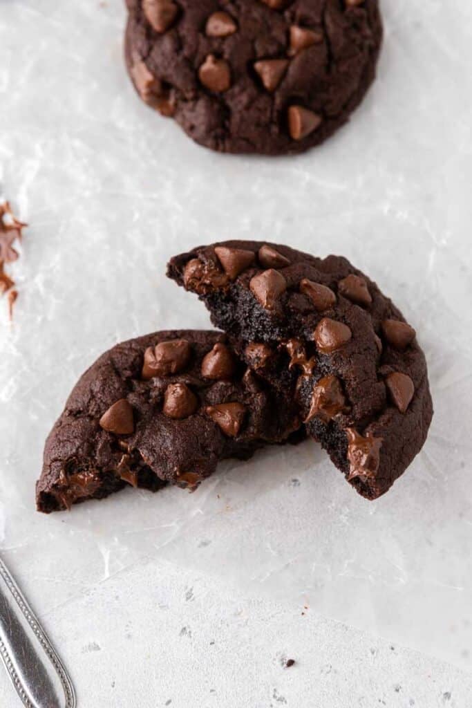 Thick double chocolate cookie split in half