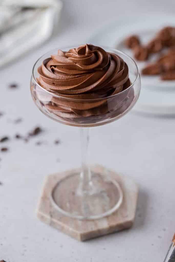 small batch chocolate swiss meringue buttercream in tall glass