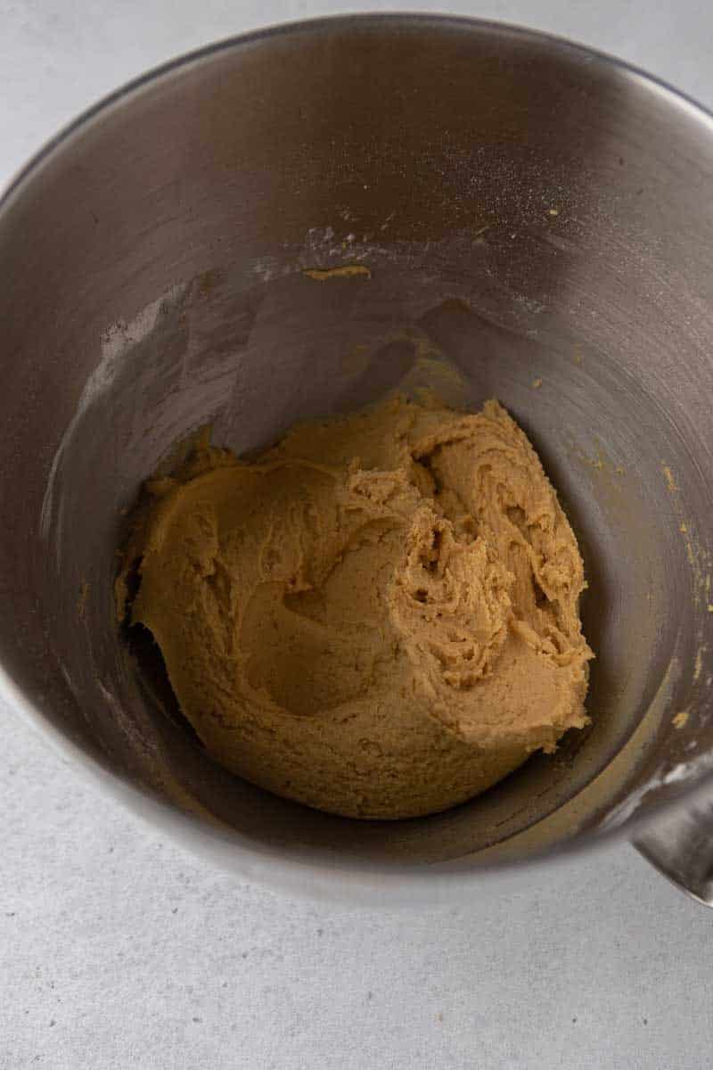 Soft pumpkin cookie dough in a mixing bowl.