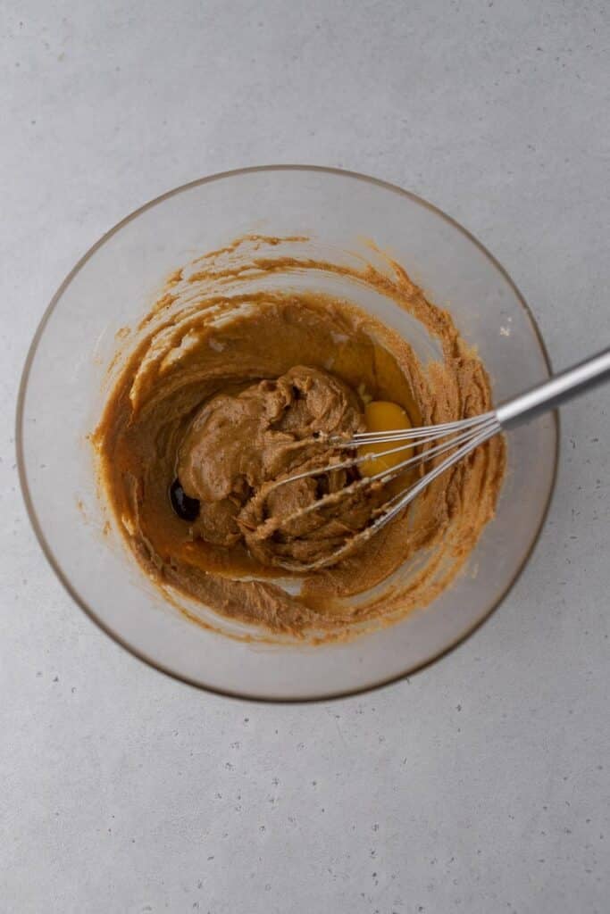 Creamed peanut butter and sugar in a bowl