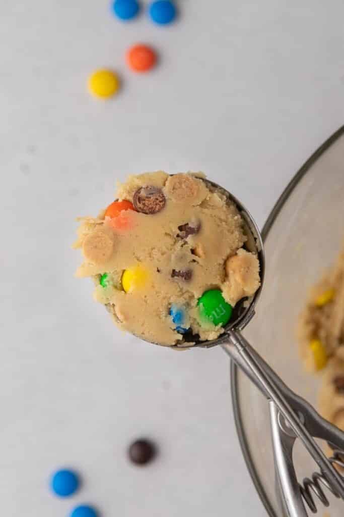 Crumbl Monster Cookies in a cookie scooper