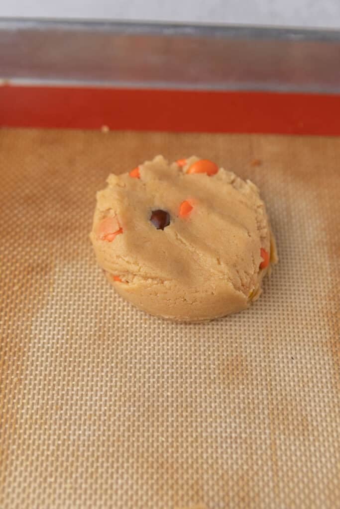 Flattened cookie dough on baking sheet