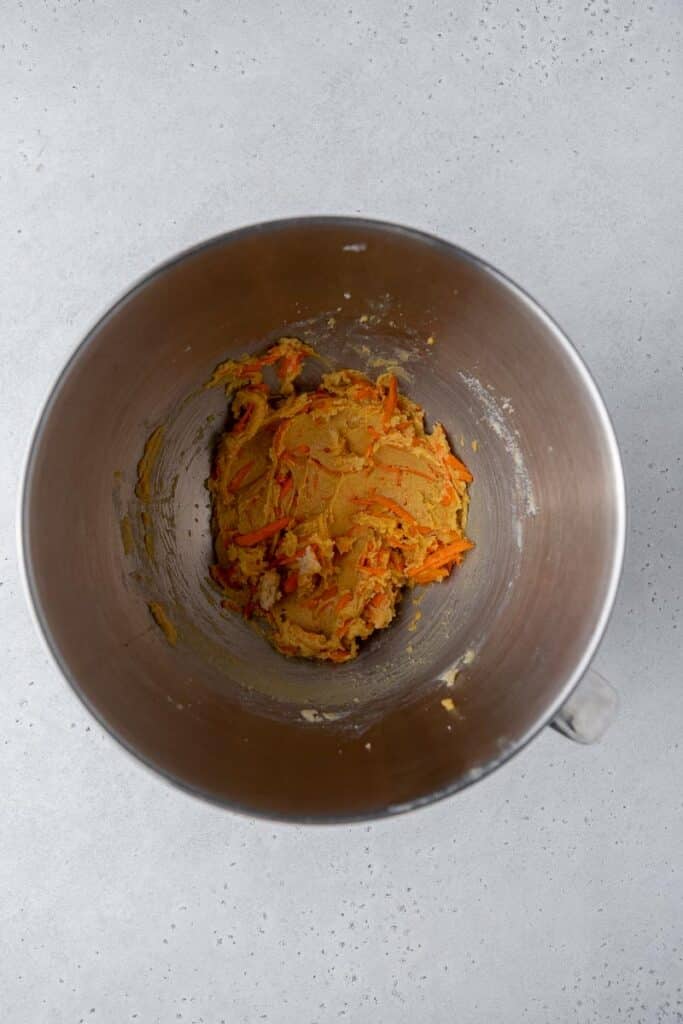 Creamed butter and sugar with carrots in mixing bowl