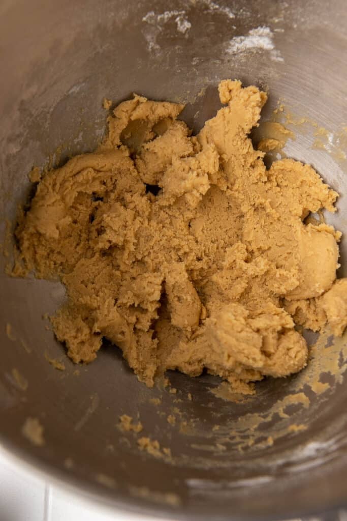 Soft cookie dough in mixing bowl