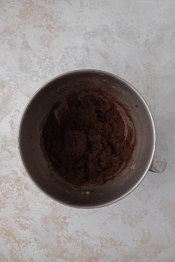 Chocolate cookie dough in a mixing bowl