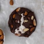 Overhead shot of chocolate cookie with almond and chocolate chips