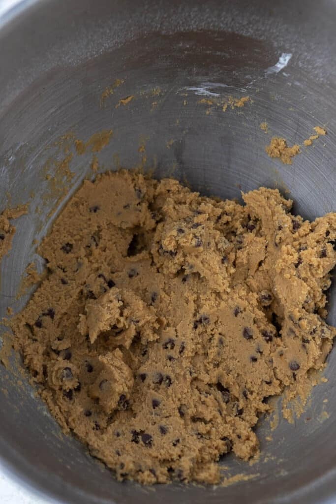 brown sugar cookie dough in mixing bowl 