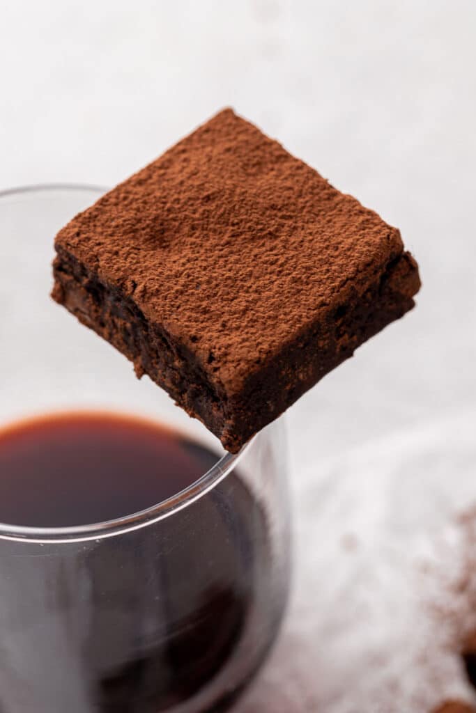 red wine brownie with a glass of wine