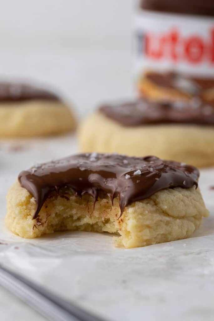 Straight on shot of sugar cookie with Nutella on top