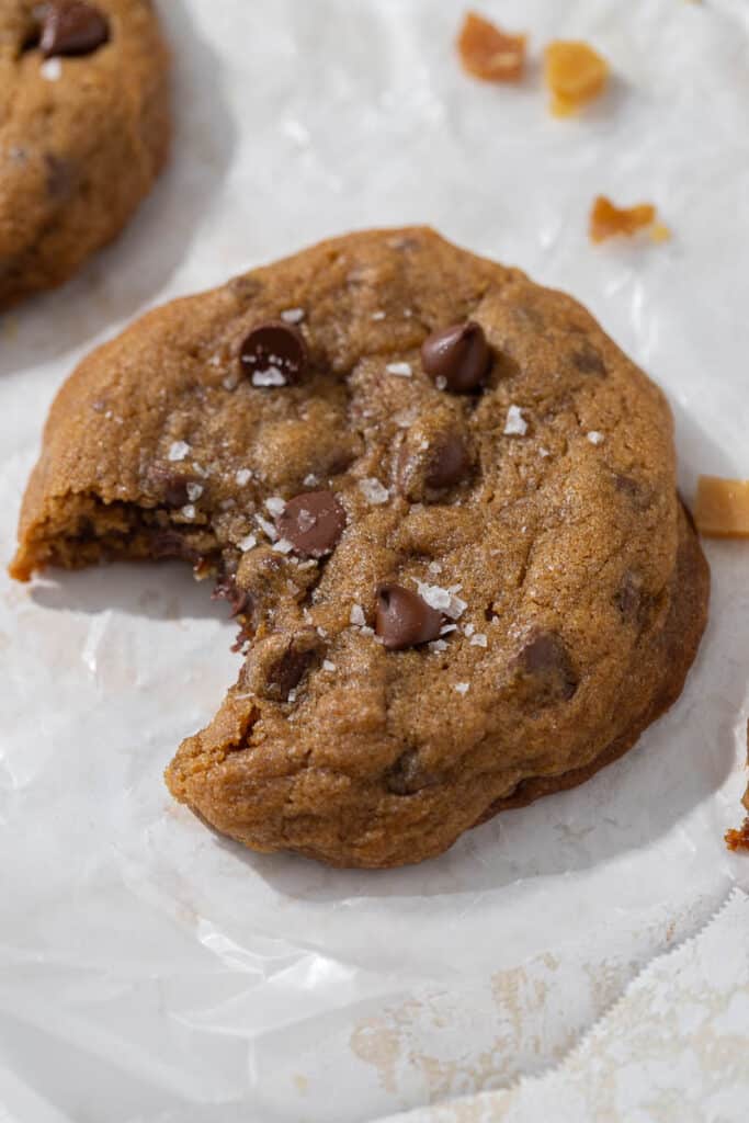 Sea salt chocolate chip toffee cookies with a bite taken out of it