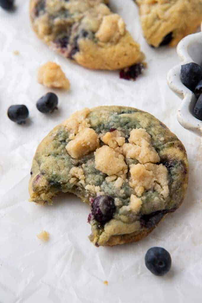 Small blueberry cookie with a bite taken out of it