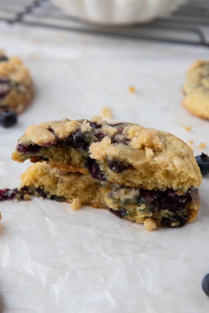 Crumbl blueberry muffin cookie cut in half