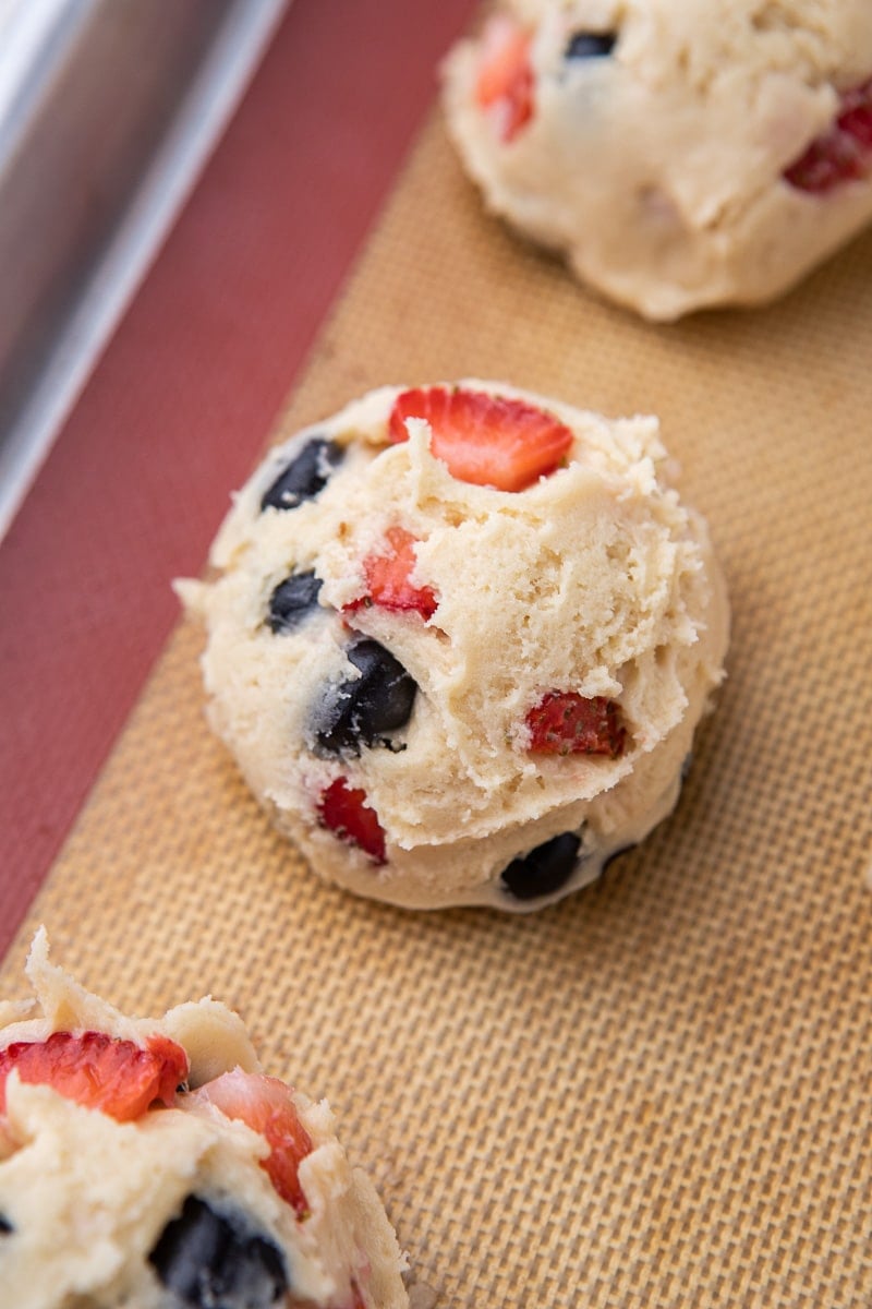 Berries and cream cookie dough on baking sheet