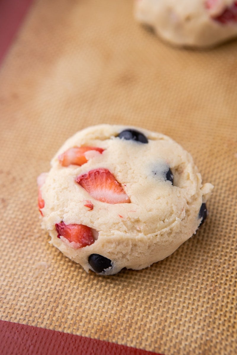 Berries and cream cookie dough on baking sheet