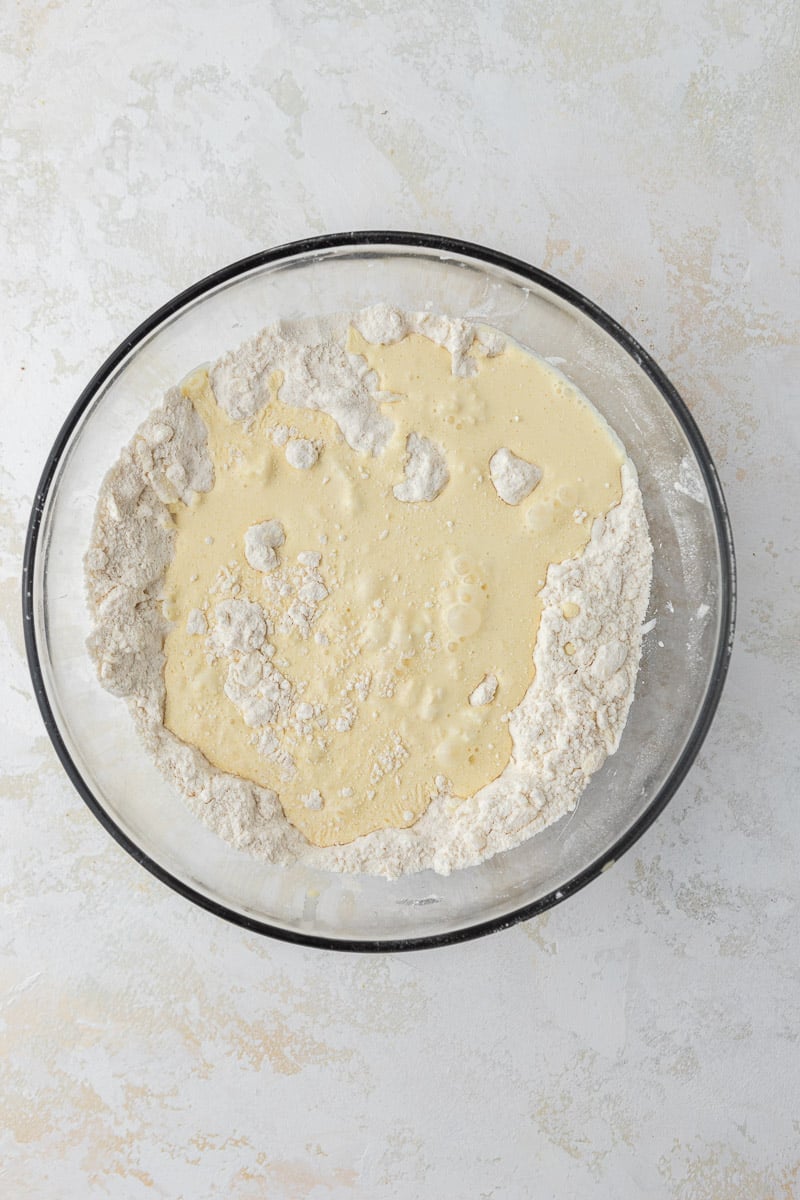 Dry ingredients with heavy cream in a bowl