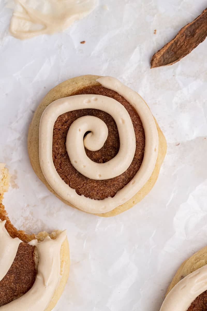 Maple cream cheese frosting on cinnamon roll cookie