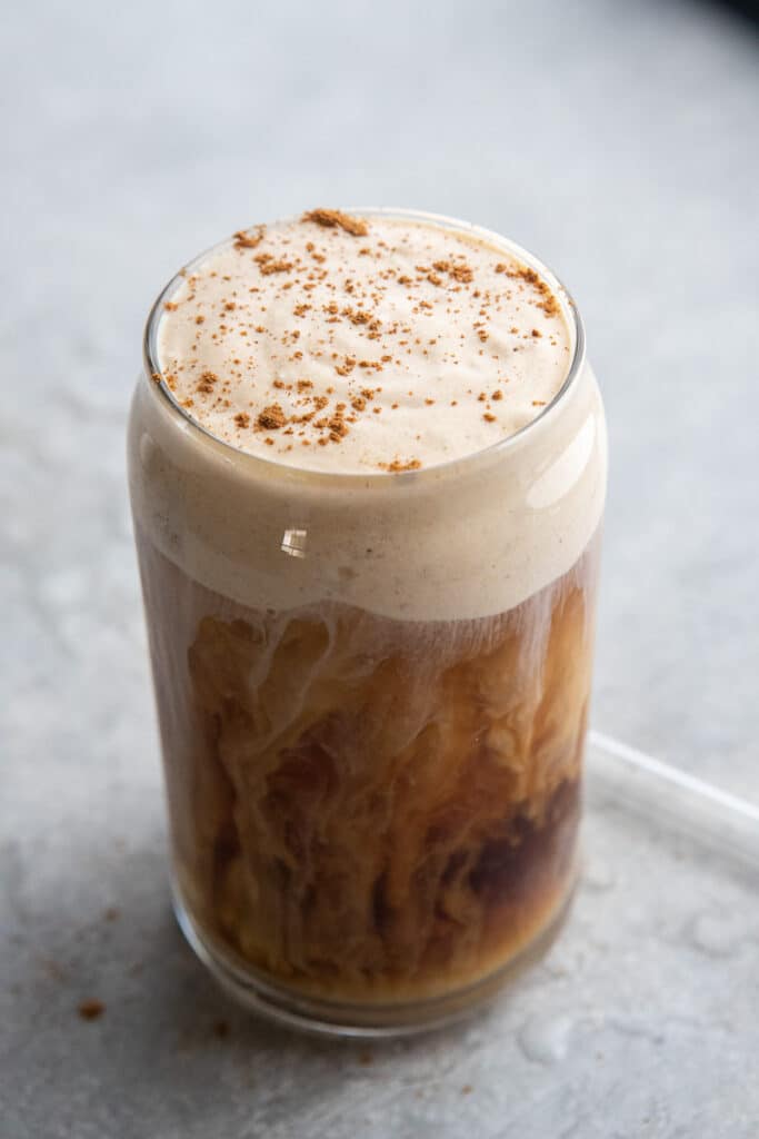 Cream swirls in coffee