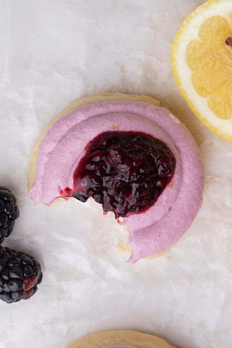 Crumbl lemon blackberry cookies with a bite taken out