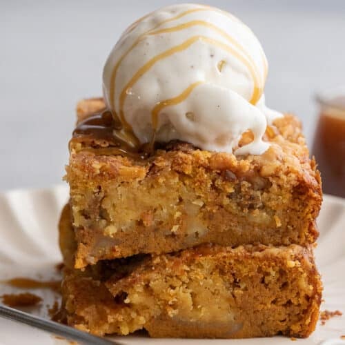 Stack of pumpkin dump cake with ice cream on top