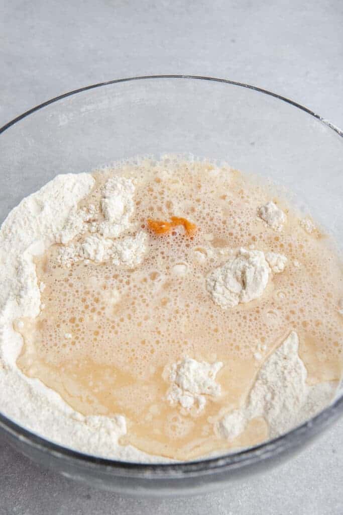 Pumpkin puree and milk poured over the dry pancake mix before whisking the batter together.