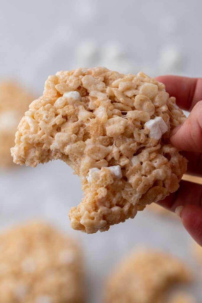 Crumbl rice krispies bar cookies with a bite taken out of them