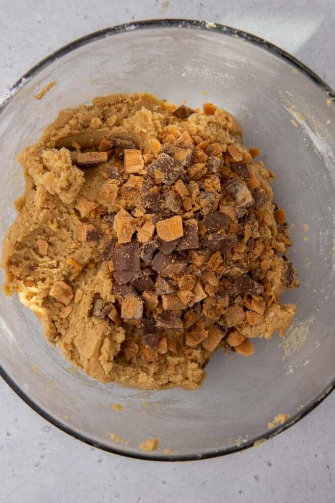 Butterfinger pieces mixed into cookie dough
