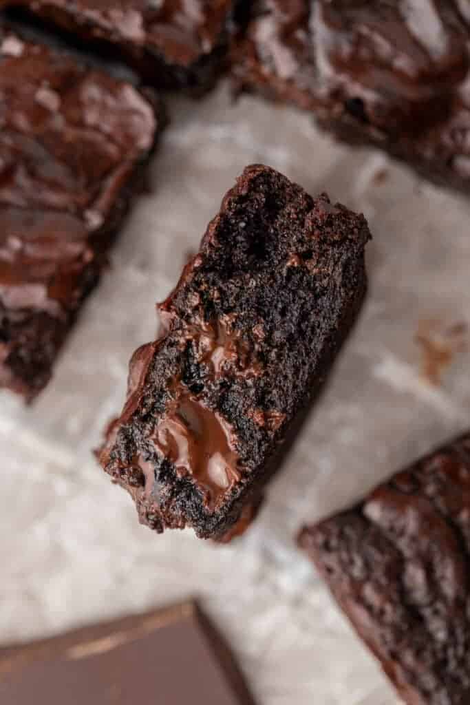 Overhead shot of brownie piece with chocolate oozing out