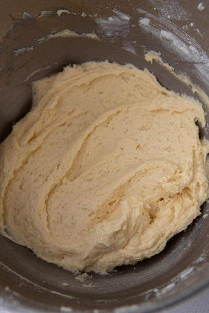 Smooth sour cream cake batter for the Starbucks copycat coffee cake recipe in a mixing bowl.