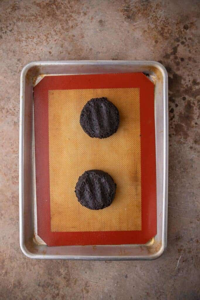 Cookie dough balls in a baking sheet