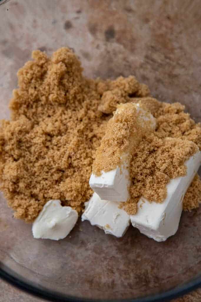 Cream cheese and brown sugar creamed together in a bowl to start the pumpkin filling.