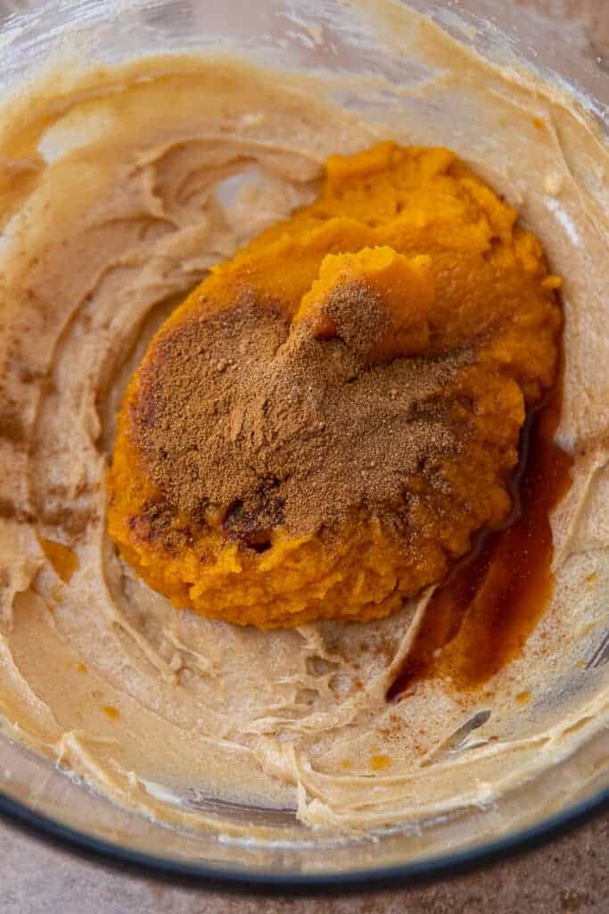 Pumpkin puree, vanilla, and pumpkin pie spice added on top of the cream cheese mixture.
