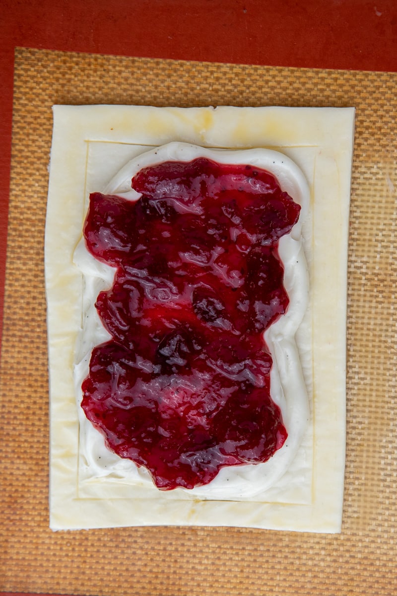cranberry sauce on top of cheese danish